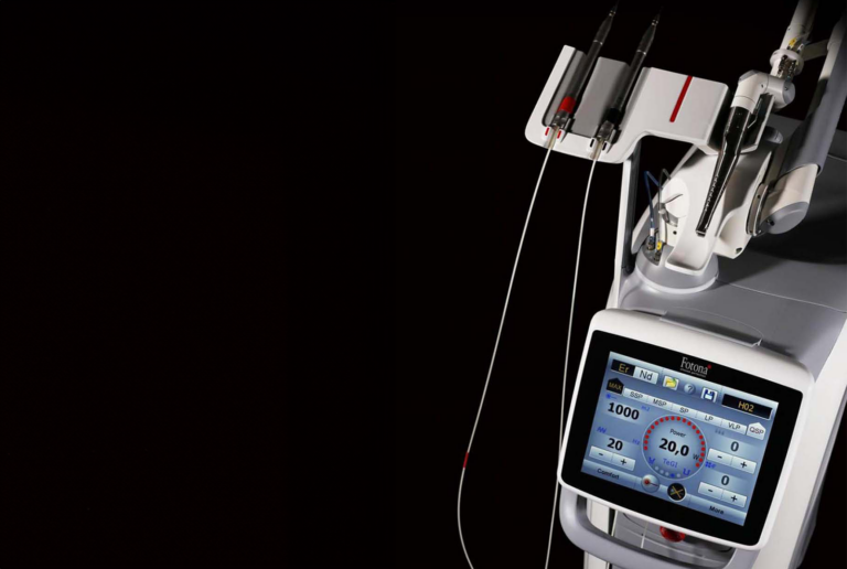Fotona LightWalker Laser, a medical device featuring a touchscreen interface for selecting modes such as Er:YAG and Nd:YAG, along with adjustable settings for power and pulse duration.